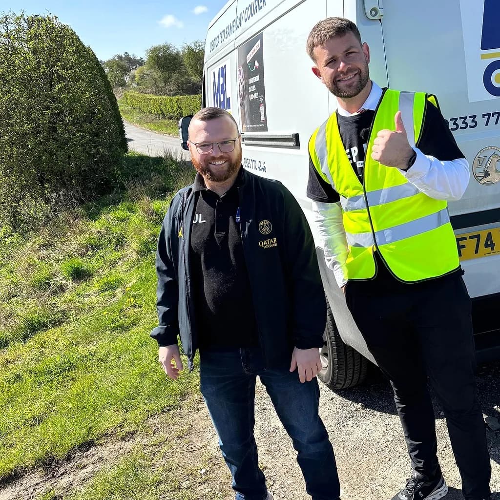 MBL Connect team members next to a branded van